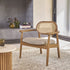 Fauteuil en teck massif, cannage et tissu grège